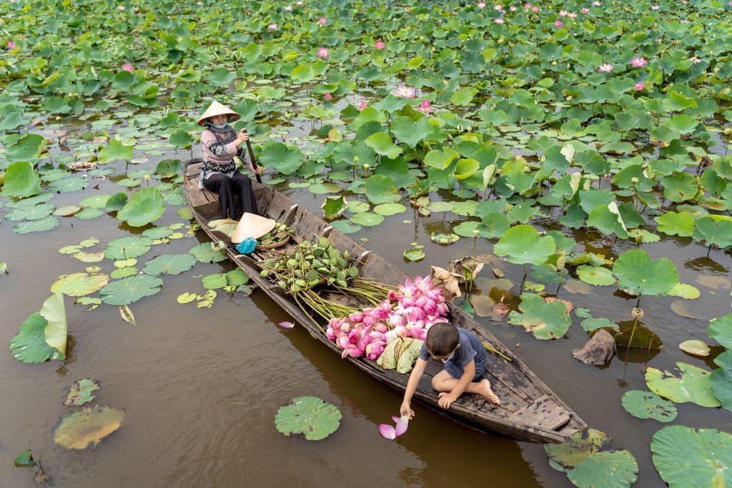 vietnamese boy playing with mom boating the tradit 2024 02 23 05 04 09 utc 2