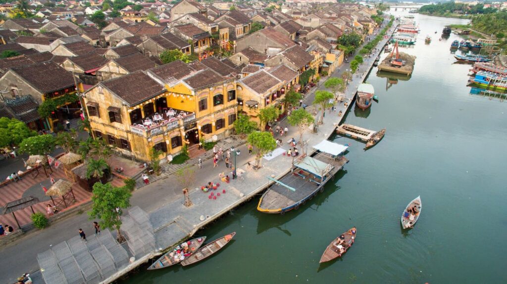 Hoi An ancient town lantern street and yellow houses at night Vietnam