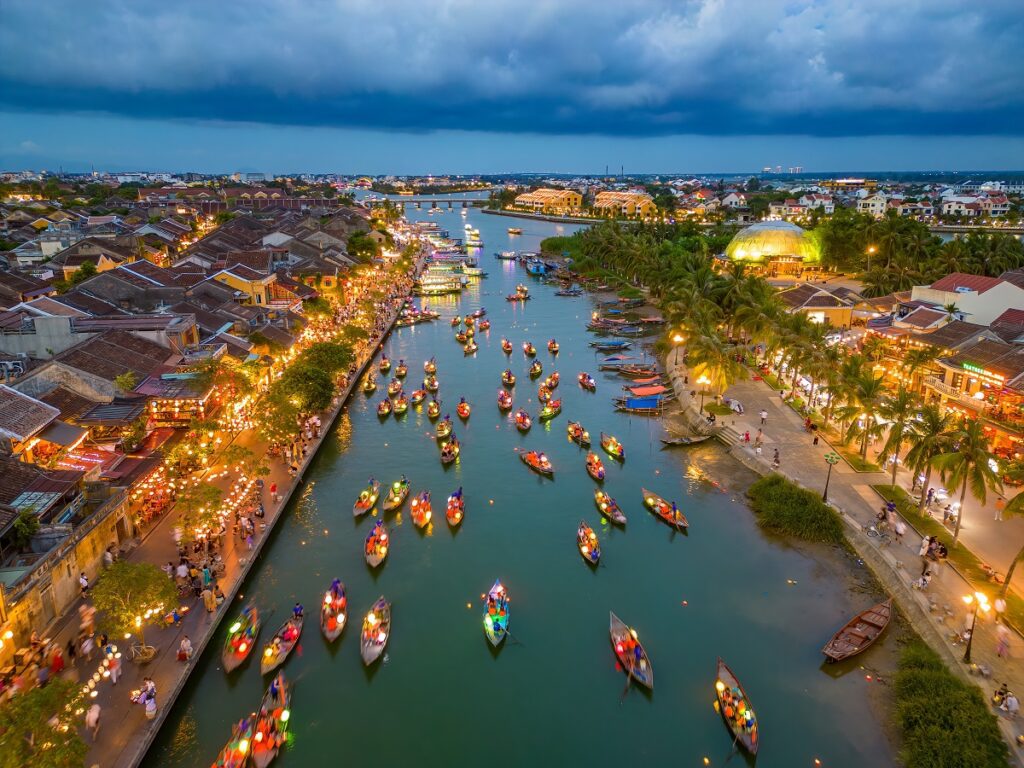 Hoi An Ancient Town at dusk — silk lanterns reflected in the Thu Bon River, Central Vietnam
