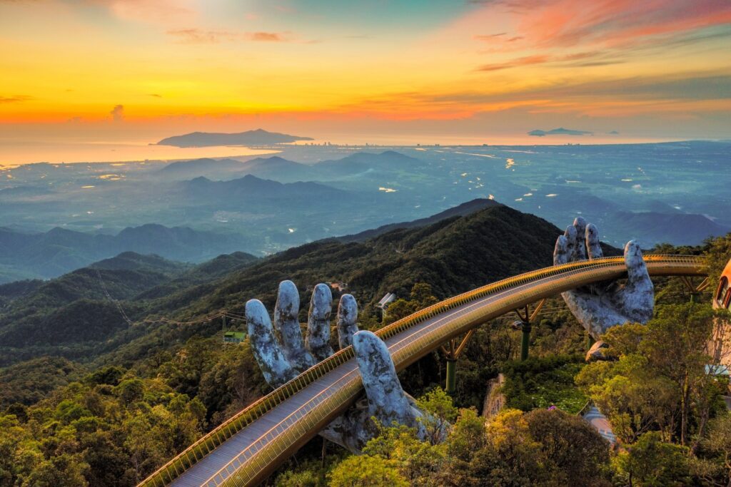 Da Nang travel guide — Golden Bridge at Ba Na Hills held by two giant stone hands, Vietnam