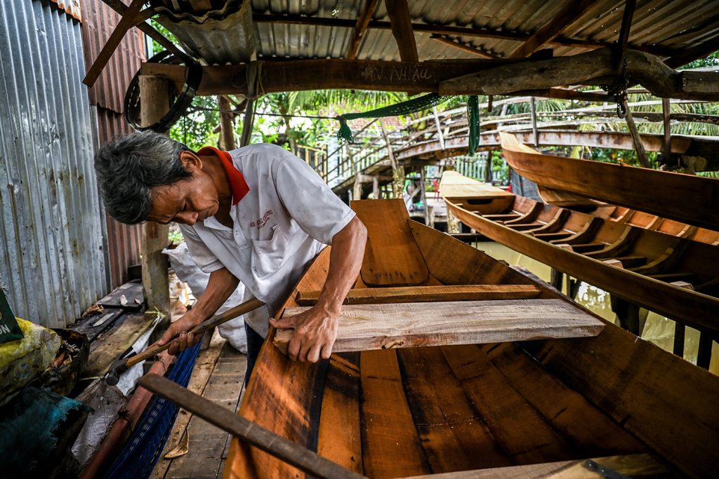 Weaving Threads of Time: Vietnam's Arts and Crafts Villages – A Timeless Treasure Trove for Your Clients 22 Boat