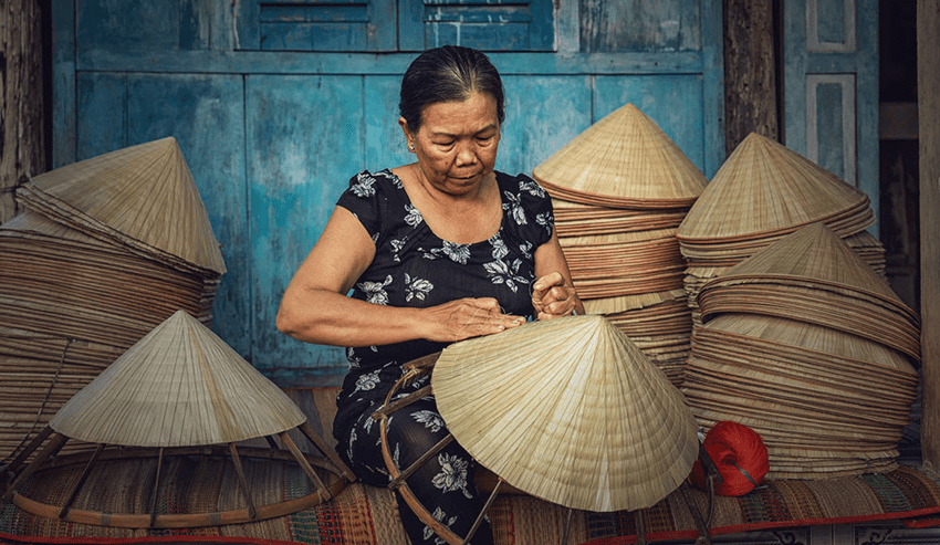 Weaving Threads of Time: Vietnam's Arts and Crafts Villages – A Timeless Treasure Trove for Your Clients 13 Conical Hat Village in Hue