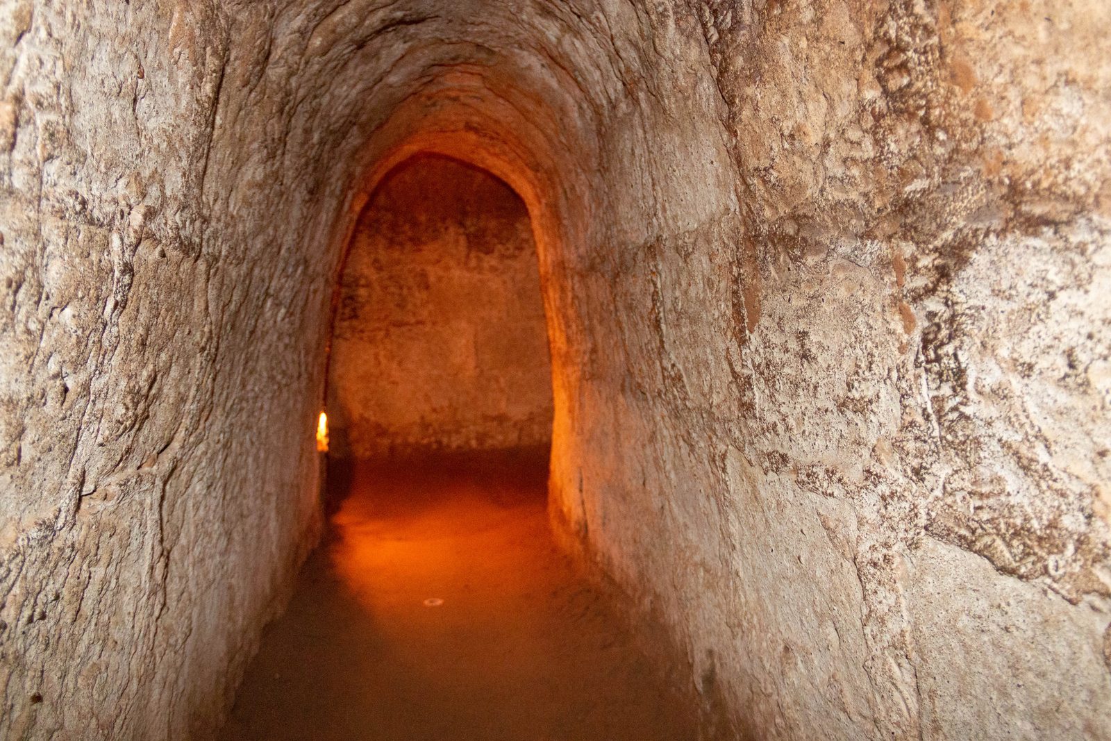 Cu Chi Tunnels 2027: How to Visit, Tickets, Ben Dinh vs Ben Duoc and What to Expect 3 Lit tunnel section inside the Cu Chi Tunnels