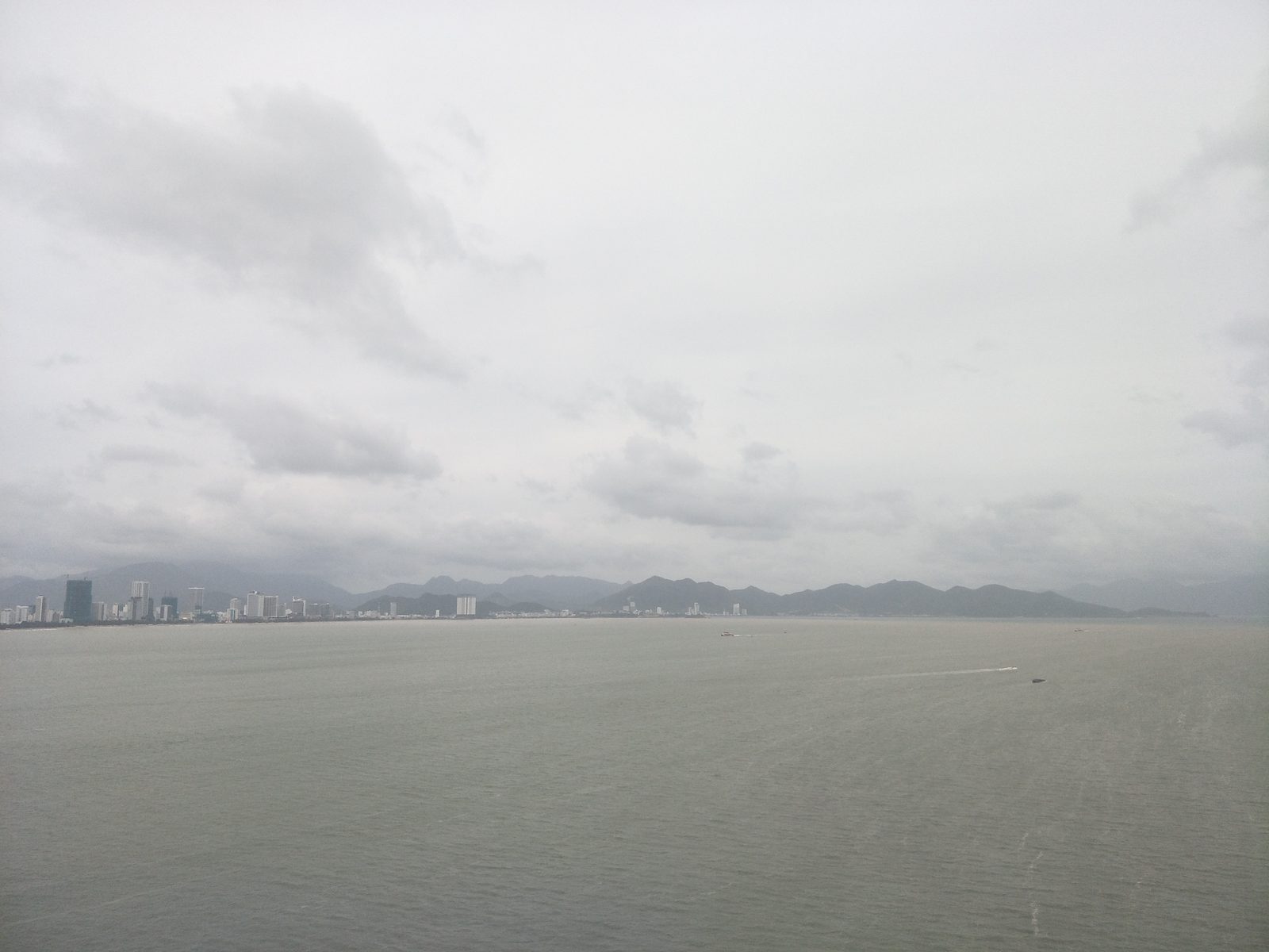 Nha Trang city beach and coastline under a blue sky