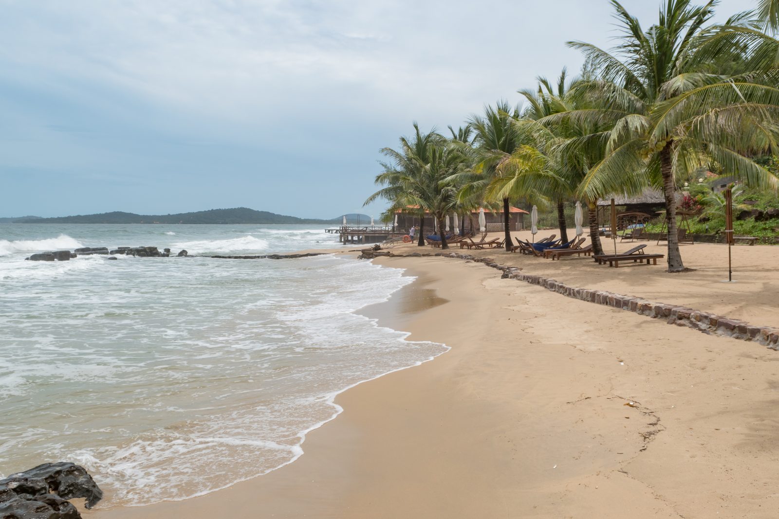 Vietnam in December, November, January or February: Where the Beach Weather Is Best Each Month 5 Curving sandy beach with palm trees on Phu Quoc island