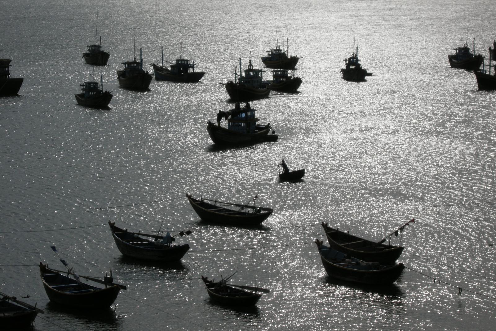 Vietnam Tour and Beach 2027: How to Combine Two or Three Weeks of Touring with Proper Beach Time 1 Fishing boats silhouetted on the water in Mui Ne harbour